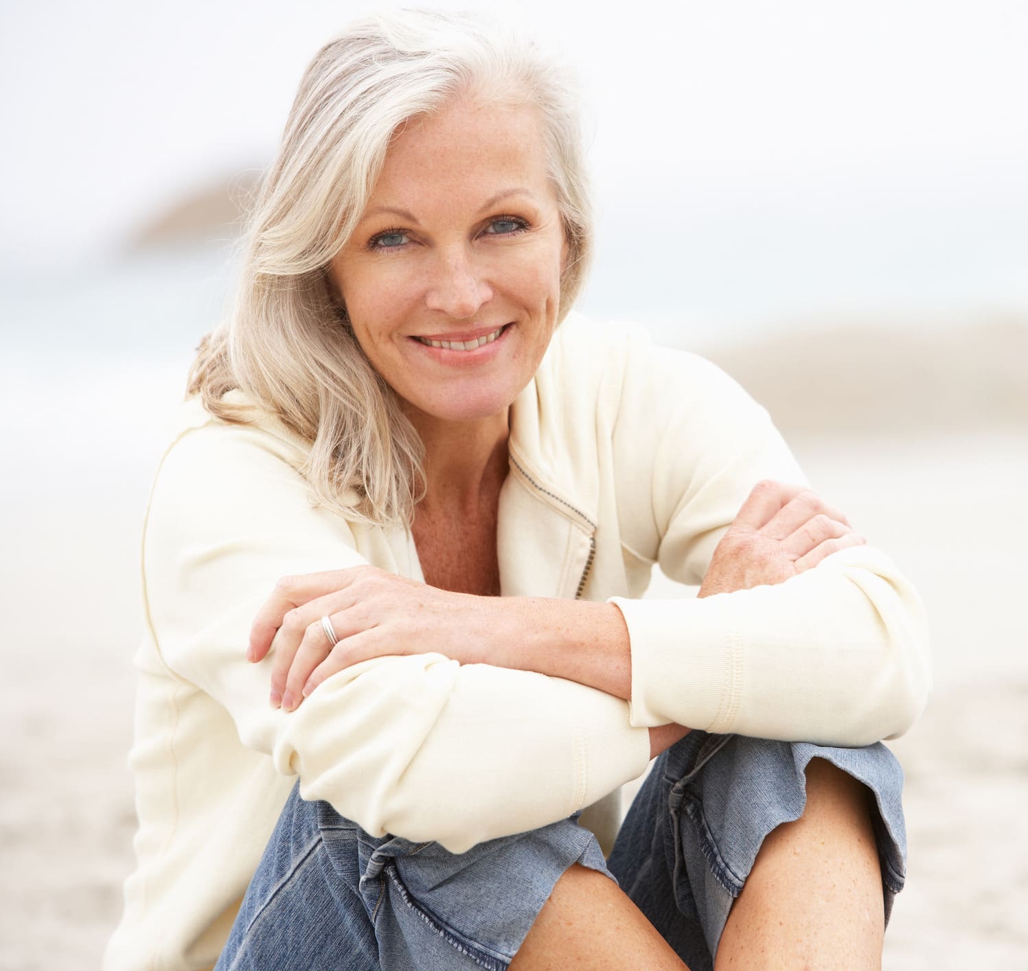 Senior Woman Sitting On Winter Beach Beautifill in Phoenix, AZ